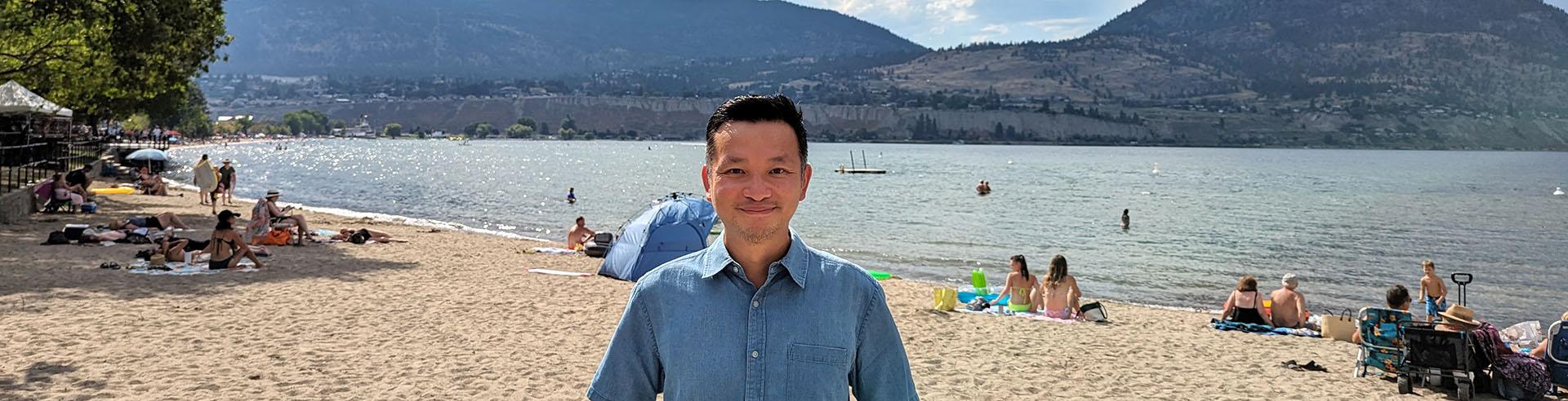 Entrepreneur standing on Okanagan lake beach