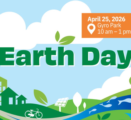 Earth Day sign over green space 