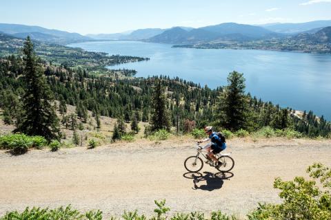 cyclist with lake in background