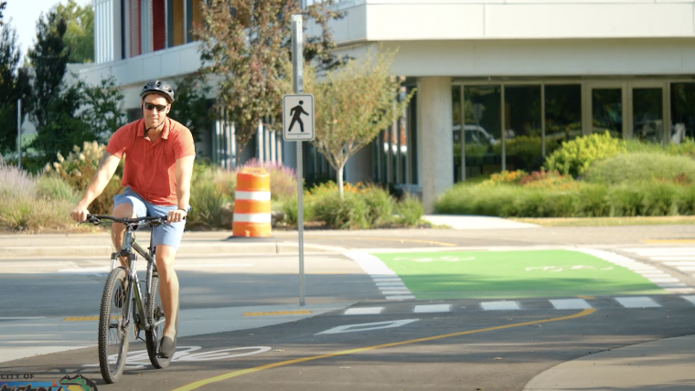 Person riding bike on road