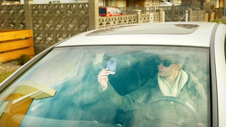 Resident hooking parking pass